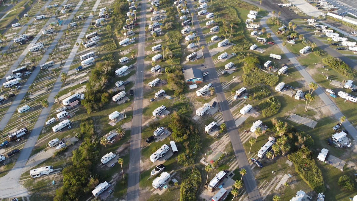 An aerial view of densely packed RVs and trailers at a lot.